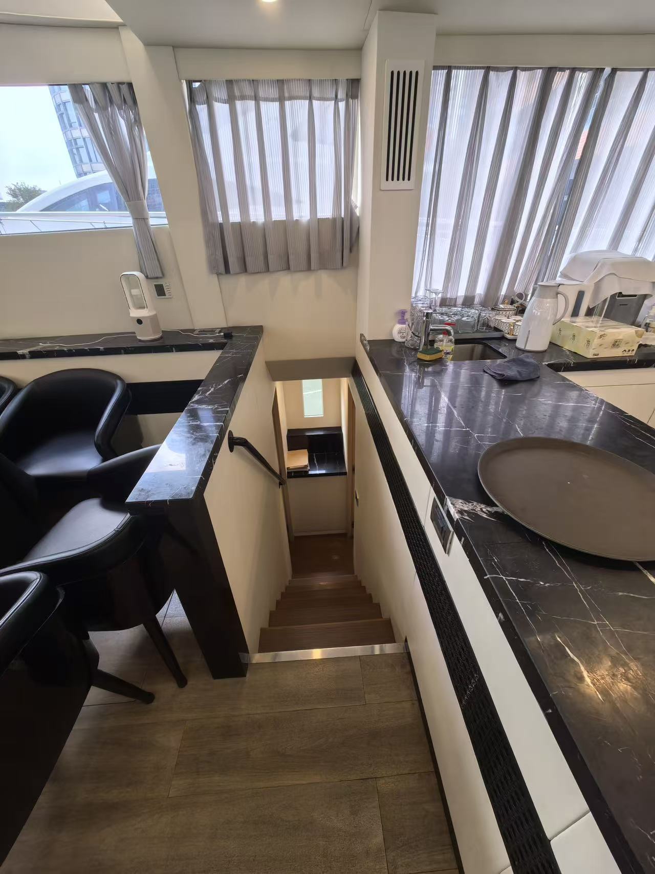 Staircase to lower cabins of Mazarin 55 sailing catamaran