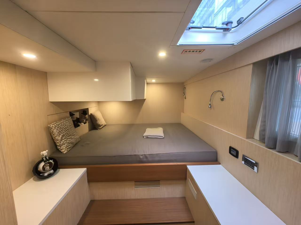 Guest cabin with skylight of Mazarin 55 sailing catamaran