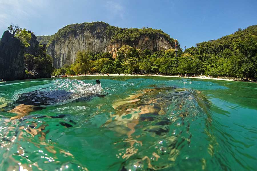 Limestone cliffs and turquoise water along the Krabi coast